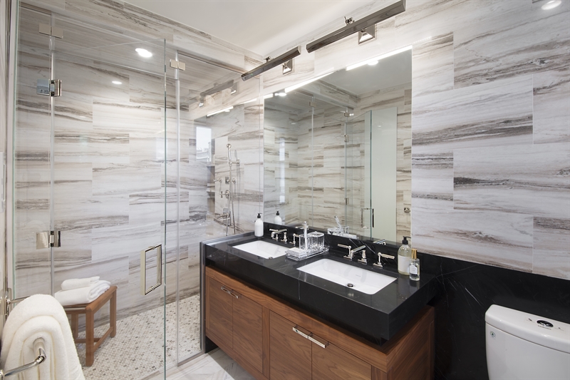 Warm, luxurious materials set the stage for elegant bathrooms accented with marble baths, Waterworks fixtures and radiant floors, providing a sanctuary all your own.